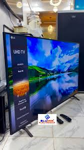 LG 65 INCHES UHD 4K SMART, MAGIC REMOTE, YOUTUBE, NETFLIX , SATELLITE TV